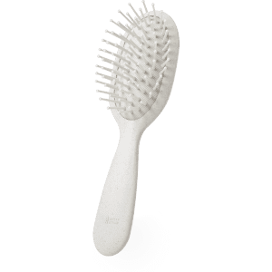 A Dantel hairbrush in white with a textured grip and flexible bristles, ideal for detangling hair.