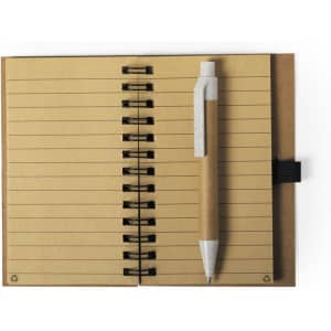 A notebook with brown pages and a spiral binding, accompanied by a beige pen. The notebook has a black pen holder.