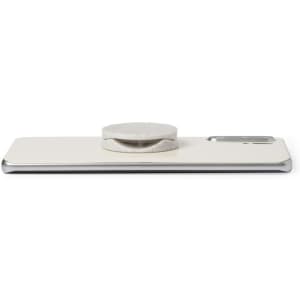 A white phone stand with a circular holder on top, featuring a sleek silver edge and a logo.