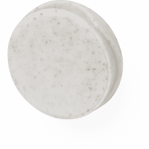 A round, white phone stand with a speckled texture and a minimalist design. Features a logo.