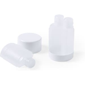 A set of white toiletry containers, including two bottles and a lid, neatly arranged.