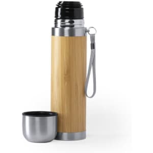A drink bottle with a bamboo exterior and stainless steel top, accompanied by a matching stainless steel cup.
