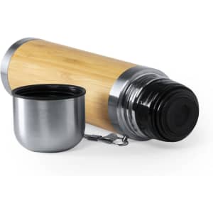 A drink bottle featuring a bamboo exterior with metallic accents, accompanied by a stainless steel cup.