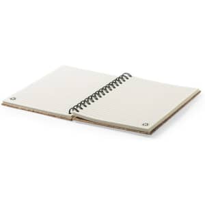 A spiral-bound notebook with cream-coloured lined pages and a simple cover featuring metal eyelets.