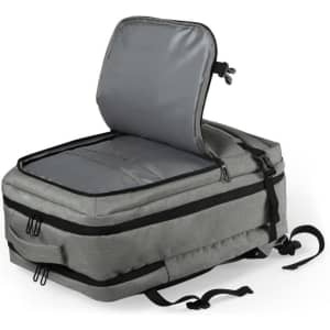 A grey backpack with a large, unzipped compartment, featuring a padded interior and adjustable straps.