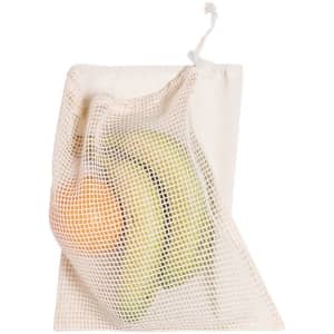 A mesh bag in cream colour, containing a green apple and bananas. The bag has a drawstring closure and a logo.