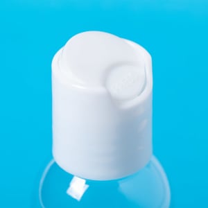 A clear bottle with a white pump top, suitable for hydroalcoholic gel. The background is a bright blue.