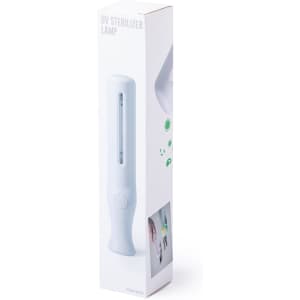 A UV sterilizer lamp in a white packaging box featuring a handle and a window showcasing the product.