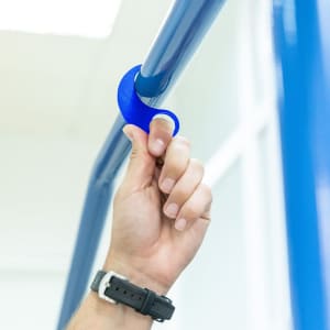 A blue Kozko Keyring Anticontact being held by a hand, designed for keyring and tool use.