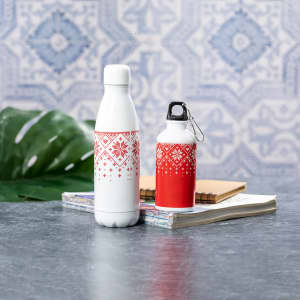 A drink bottle set featuring a white bottle with a red patterned design and a smaller red bottle with a black cap.