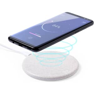 A wireless charger in light grey with a smartphone hovering above, indicating charging progress.