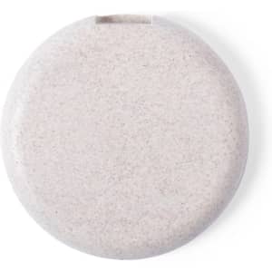 A circular wireless charger in a light beige colour with a smooth finish and a subtle logo.