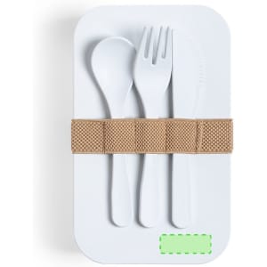 A white lunch box with a tan strap, containing a spoon, fork, and knife. It features a logo on the front.
