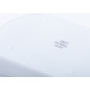 A white antibacterial pillbox featuring a smooth surface and small raised dots for grip. It has a logo.