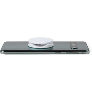 A white antibacterial phone holder resting on the back of a sleek black smartphone.