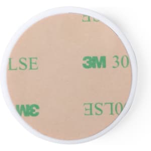 A round adhesive film with a beige surface featuring printed text. The border is white.