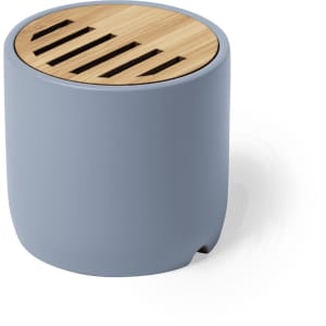 A blue speaker with a bamboo top featuring slats for sound emission. It has a round, compact design.