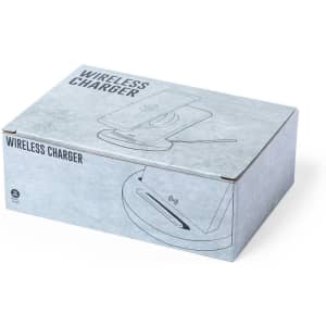 A grey box containing a wireless charger, featuring a logo and minimalistic design.