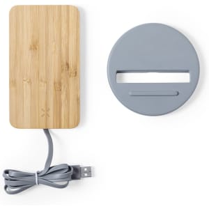 A wireless charger featuring a bamboo panel and grey base, accompanied by a grey USB cable.