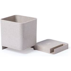A square, light grey pencil holder with a removable lid and base, featuring a logo on the lid.