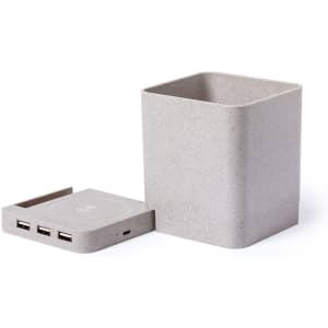 A grey multifunction pencil holder with a detachable base featuring USB ports. Includes a logo on the base.