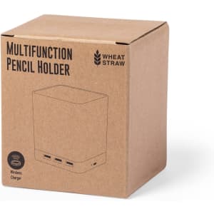 A cardboard box containing a multifunction pencil holder in a natural colour with a logo and multiple charging ports.