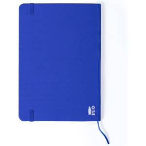 A blue notepad with an elastic band and a ribbon bookmark, featuring a logo on the front cover.