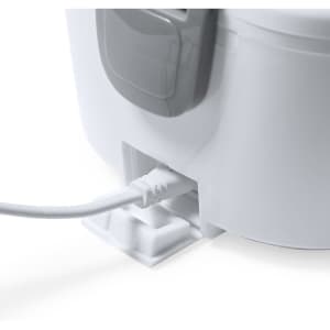A white electric lunch box with a grey handle, featuring a cable connection at the base.