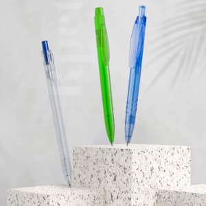 Three plastic pens in clear, green, and blue colours displayed on textured white surfaces. Each pen features a logo.