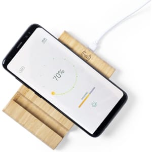 A wireless charger with a wooden base, featuring a smartphone displaying a charging status graphic.