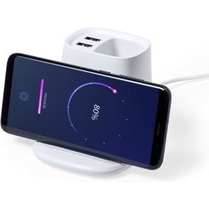 A white multifunction pencil holder with a phone charging on it, featuring two USB ports.