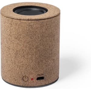 A cylindrical speaker in a natural cork finish with a USB-C port and a power button.