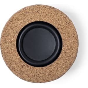 A round speaker featuring a cork exterior and a black audio speaker grille at the centre. It has a simple design.
