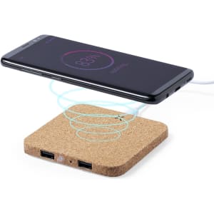 A wireless charger with a cork base and two USB ports, featuring a smartphone hovering above it.