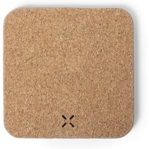 A square wireless charger in a natural cork finish, featuring a simple design and minimal branding.