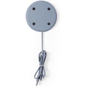 A circular grey wireless charger with a matching cable. The charger features four attachment points on its surface.