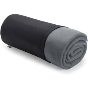 A rolled-up blanket in grey, wrapped in a black protective cover, featuring a small logo.