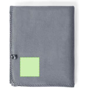 A grey blanket with a stitched border and a branding tag in one corner.