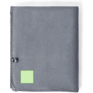 A grey blanket with a stitched edge and a small branding label. Features a green square section.