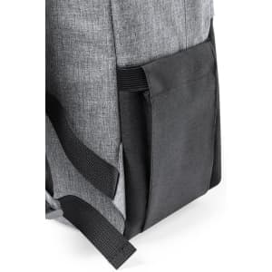 A grey backpack featuring a side pocket with black detailing and black straps. It includes a branding logo.
