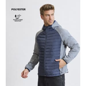 A man wearing a water and wind-resistant soft shell jacket featuring a navy front and light grey sleeves.