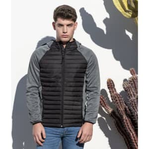 A soft shell jacket featuring black and grey panels, with a front zip and a fitted design. It has a logo on it.