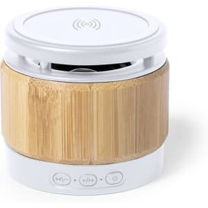 A small circular speaker with a bamboo exterior, featuring a white top and control buttons on the bottom.