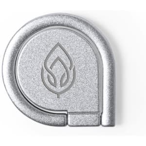 A silver phone holder with a circular design and a branding logo displayed on its surface.