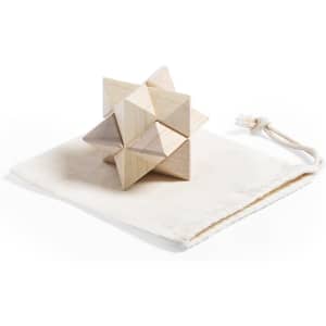 A wooden puzzle made of interlocking triangular pieces, resting on a beige fabric pouch.
