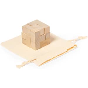 A wooden puzzle game in a natural colour, resting on a beige fabric pouch. It features interlocking pieces.