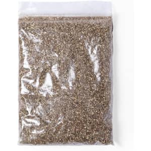 A sealed plastic bag containing a mixture of brown and grey seeds, ideal for planting or gardening.