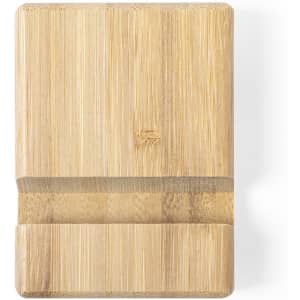 A bamboo phone stand with a minimalist design, featuring a slot for holding a mobile device.
