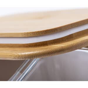 A bamboo lunch box featuring a natural wood top and a transparent base, with a logo visible on the side.