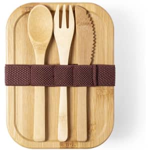 A bamboo lunch box featuring a fork, knife, and spoon secured with a brown elastic strap.